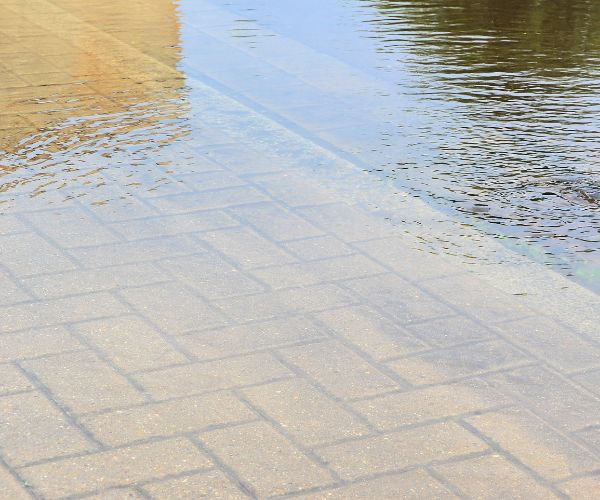 Floor pavers flooded with dirty water will need sanitation cleaning after it passes